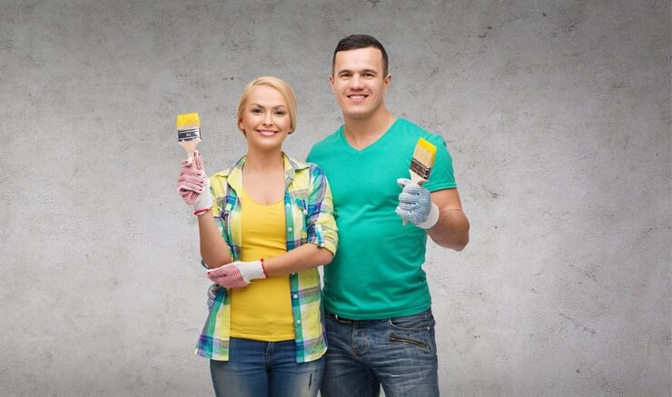 repair construction maintenance concept smiling couple with paintbrush_380164 58651